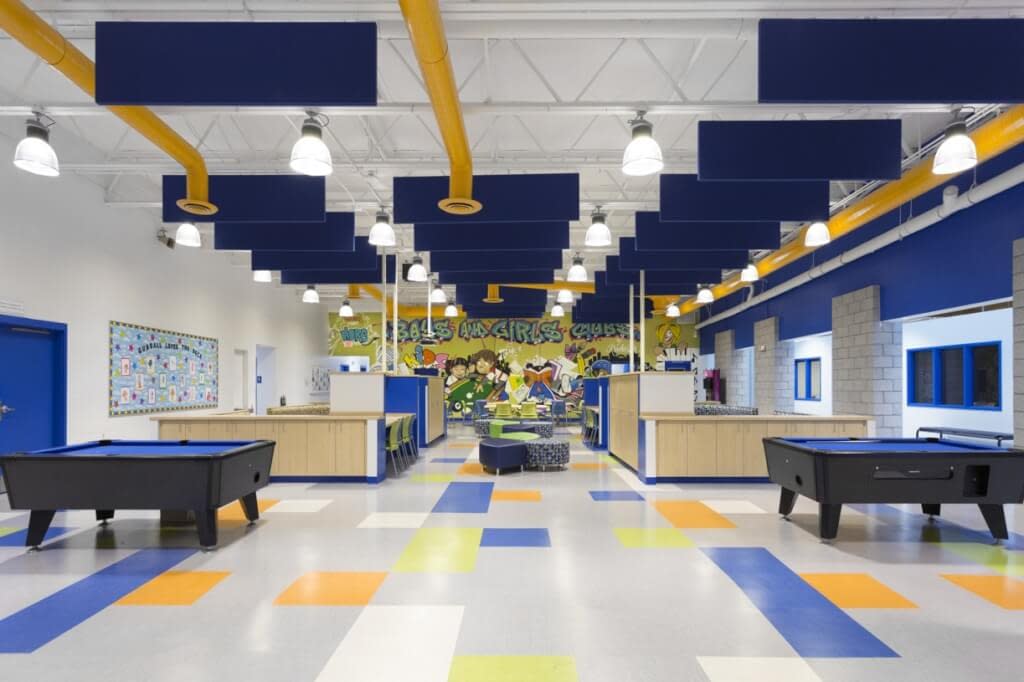 Game room Boys and Girls Club Rochester NY bright colors graffiti mural exposed structure exposed ductwork