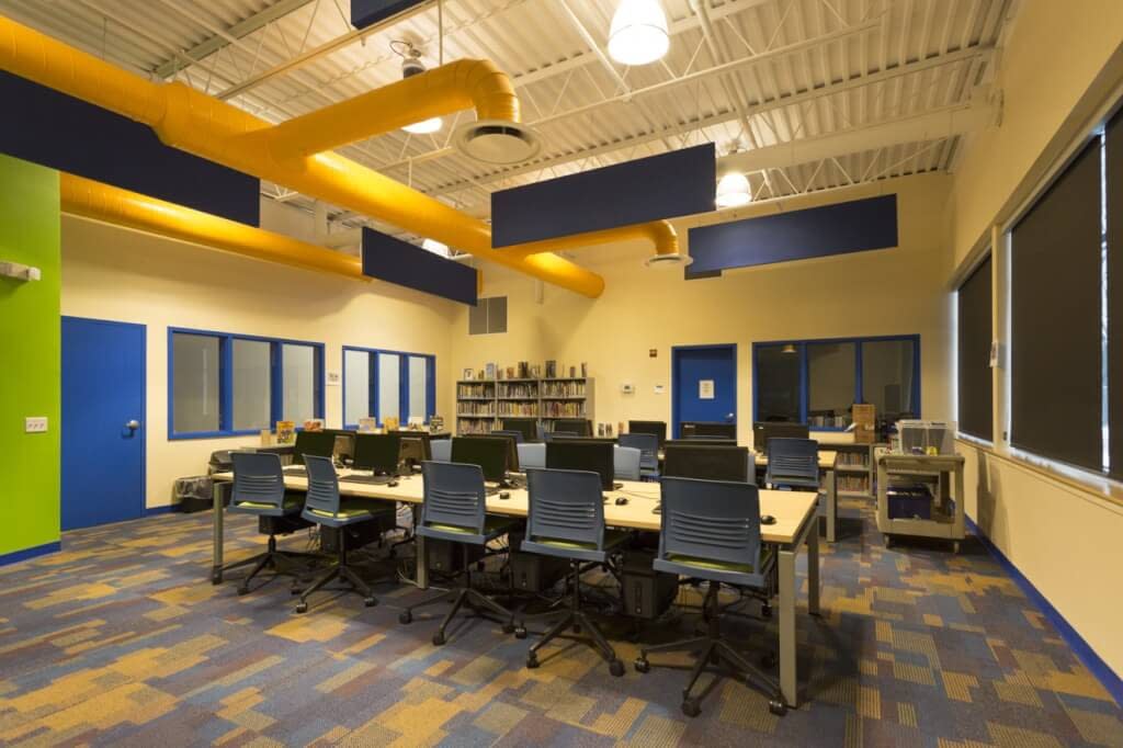 Boardroom Boys and Girls Club of Rochester NY bright colors exposed ductwork and structure